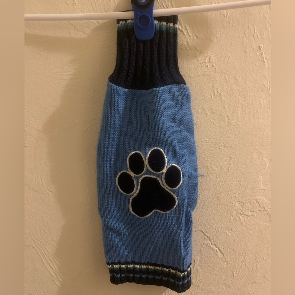 Blue paw print turtleneck sweater. Size Medium
